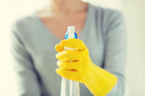 Cleaner completing a risk assessment before starting work