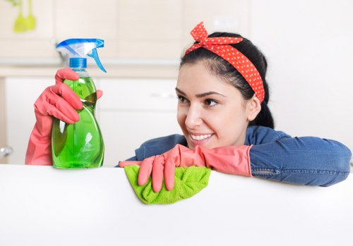 Cleaner using protective equipment during routine cleaning