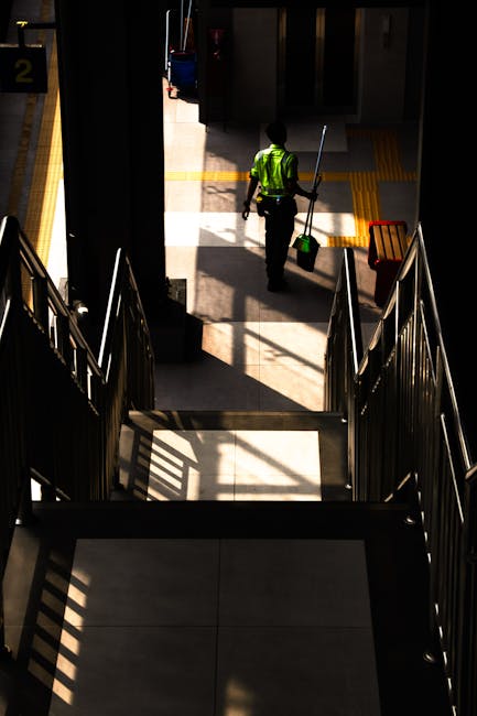 A view of Finsbury Park train station platform in Bromley North area, featuring clean, tiled surfaces and metal benches under a corrugated roof. The platform area is well-lit with natural daylight, sh